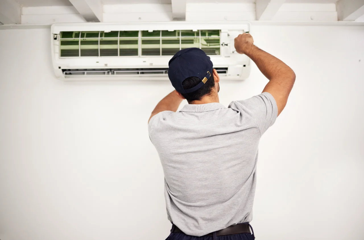 maintenance air conditioning technician man from back working ventilation filter ac repair contractor handyman electric aircon machine expert problem solving electrician with tools